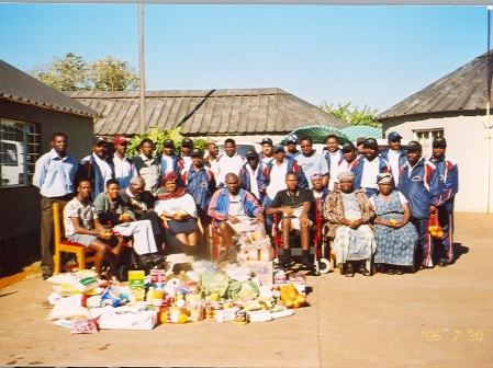 Donations are presented to the patients/residents at Cheshire Holmes, Matsapha, Swaziland, 2007. 